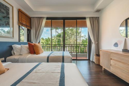 Ένα ή περισσότερα κρεβάτια σε δωμάτιο στο Laguna Village 4-BR Pool Villa by Stayisle