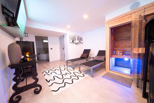 TV a/nebo společenská místnost v ubytování La Maison di Luca