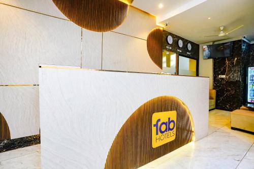 a fast food restaurant with a sign on a wall at FabHotel Melody NX in Thane