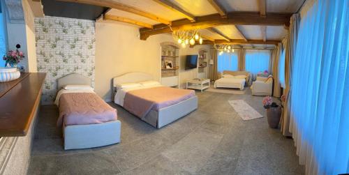 Postel nebo postele na pokoji v ubytování Villa Simona