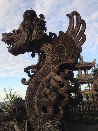 a statue of a dragon in front of a building at Biorock Homestay & Dive Center Pemuteran in Pemuteran