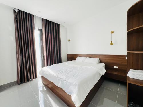 Ένα ή περισσότερα κρεβάτια σε δωμάτιο στο Tea hotel by Chiến Hảo