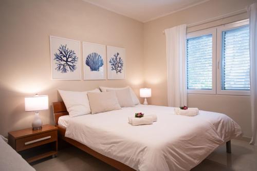 Ένα ή περισσότερα κρεβάτια σε δωμάτιο στο La Villa-Silba