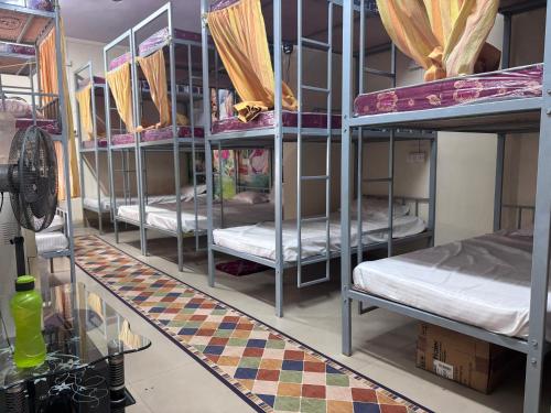 Ένα ή περισσότερα κρεβάτια σε δωμάτιο στο Luxe Sleep Dormitory