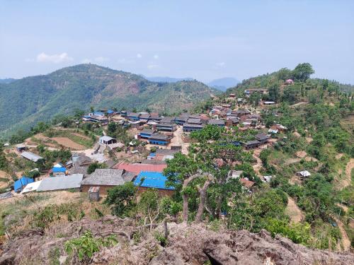 a village on top of a mountain at Culture home, home stay in Bandīpur