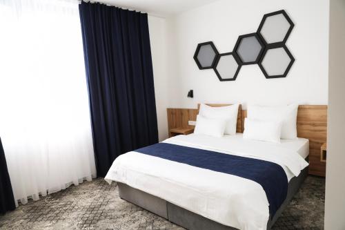 Ένα ή περισσότερα κρεβάτια σε δωμάτιο στο Hotel Karting