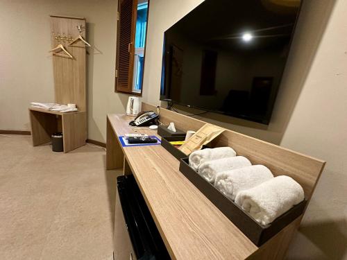 a bathroom with a counter with towels on it at 계룡 호텔 스테이318 in Gyeryong