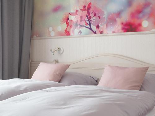 Postel nebo postele na pokoji v ubytování Vier Jahreszeiten Suite