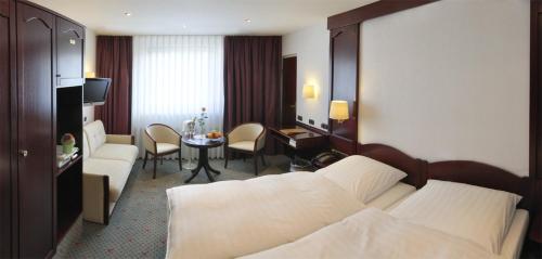 Postel nebo postele na pokoji v ubytování Hotel Imperial