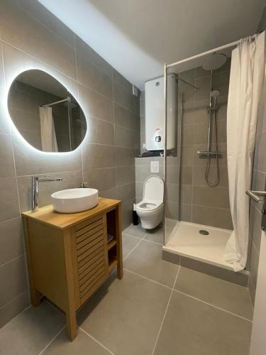 Et badeværelse på À deux pas du centre ville