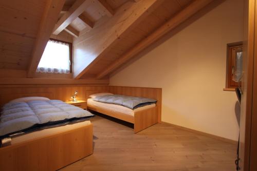 Postel nebo postele na pokoji v ubytování Varesco Appartamenti