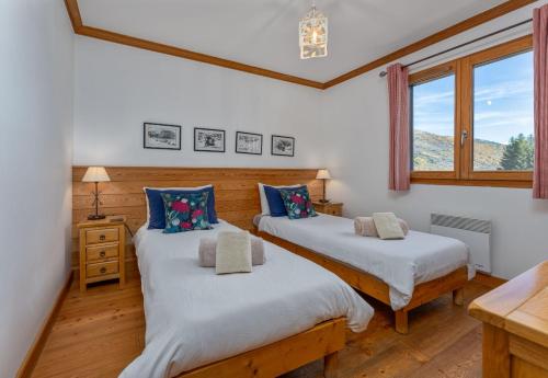 Postel nebo postele na pokoji v ubytování Chalet Apartment Monêtier