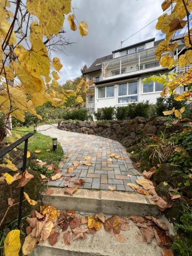 a stone walkway in front of a building at Wohnung mit schönem Aussicht in Bendorf