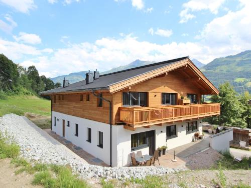 a house on a hill with a balcony at Apartment in Piesendorf near Ski Slopes in Piesendorf