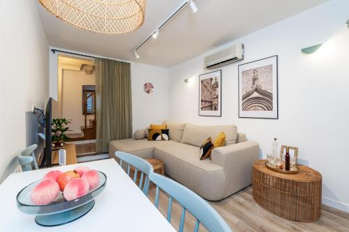 a living room with a couch and a table at Villa LaPetra in Cavtat