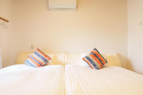 Кровать или кровати в номере Tenjin Bridge Guestroon Maximum 10 people