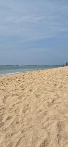 a sandy beach with the ocean in the background at Brizo Paradiso in Matara