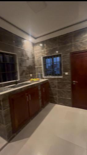 a kitchen with a sink and a window at Luxo in Cotonou