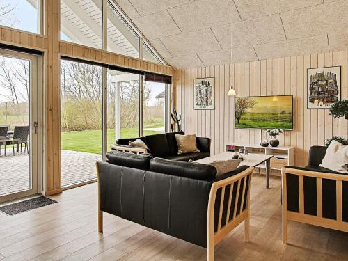 a living room with a couch and a table at 5 star holiday home in Kappeln in Kappeln