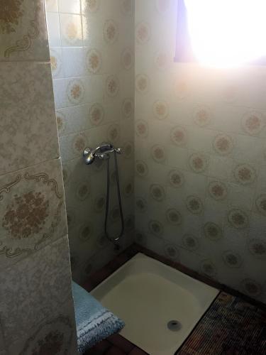a bathroom with a shower and a toilet at La Maison de Campagne in Estalane
