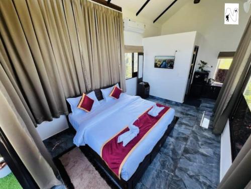 Ένα ή περισσότερα κρεβάτια σε δωμάτιο στο Grassland Voyages