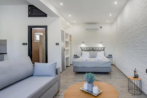 a living room with a bed and a couch at Seaside Suite in Galissas