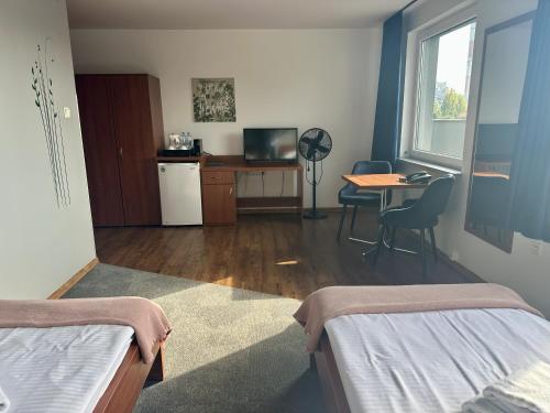 Postel nebo postele na pokoji v ubytování Gościniec PROMUS