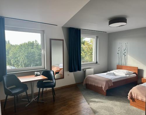 Postel nebo postele na pokoji v ubytování Gościniec PROMUS