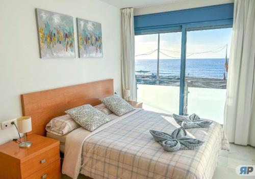 Ένα ή περισσότερα κρεβάτια σε δωμάτιο στο Apartamentos Varadero Sea View