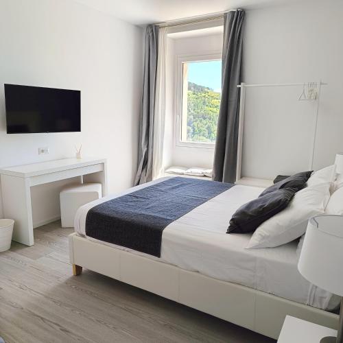 Postel nebo postele na pokoji v ubytování Osilo Rooms