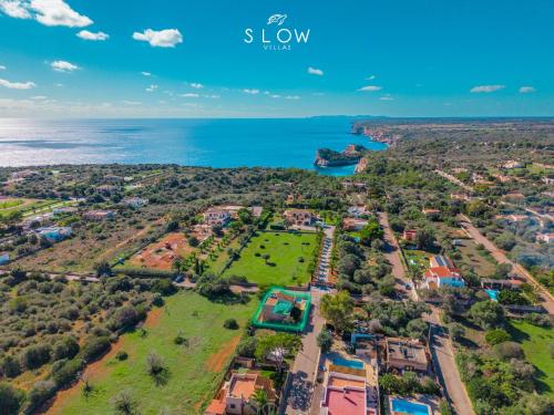 an aerial view of a park next to the ocean at Villa Sa Llimonera by Slow Villas in Cala Llombards