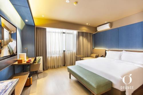 Ένα ή περισσότερα κρεβάτια σε δωμάτιο στο Orange Hotel Beijing Yongfeng Space City