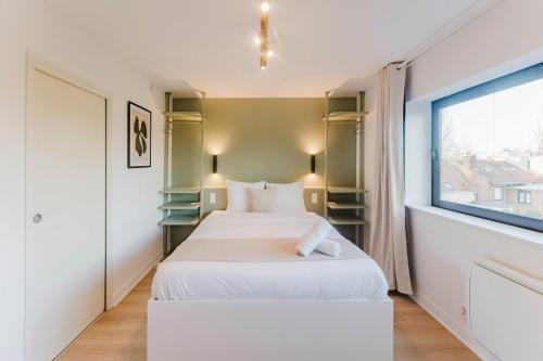 Postel nebo postele na pokoji v ubytování Renovated studio apartment in Marcq-en-Barœul