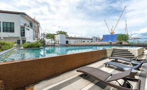 a swimming pool on top of a building at Z cape 1 one one in Laguna Phuket