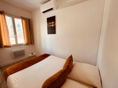 Llit o llits en una habitació de Chez Loïc Cassis