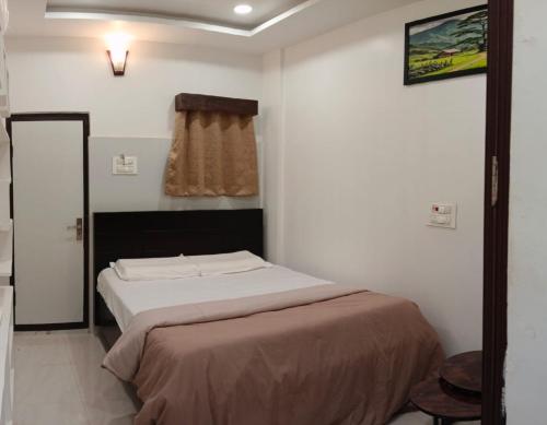 Voodi või voodid majutusasutuse BVR Dazzle Residency toas