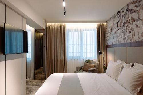 Postel nebo postele na pokoji v ubytování Hotel Savior