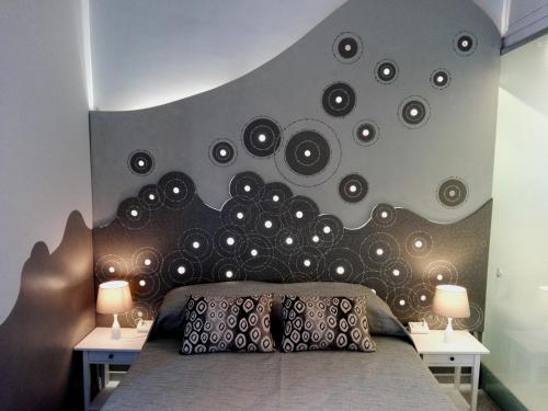 En eller flere senge i et værelse på Aleardo Aleardi