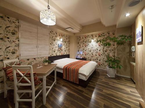 Ένα ή περισσότερα κρεβάτια σε δωμάτιο στο Hotel Charmies Meito - Adult Only