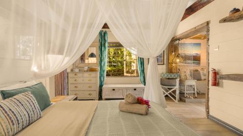 Postel nebo postele na pokoji v ubytování La Cabane du Pecheur