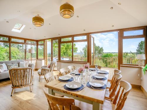 a dining room with a table and chairs at Halfstone House in Llanelli