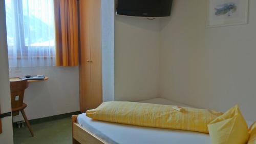 Postel nebo postele na pokoji v ubytování Sonnenhotel Soldanella Sonneck