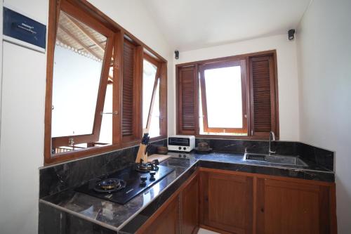 Η κουζίνα ή μικρή κουζίνα στο Kania Rooms & Suite