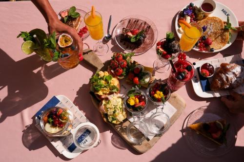 a table topped with plates of food and drinks at Milk and cookies in Venlo