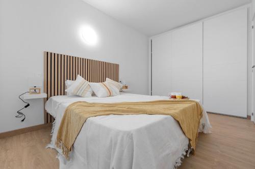 Кровать или кровати в номере AQUAMARINA II Apartments