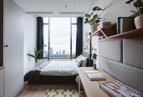 Postel nebo postele na pokoji v ubytování Sky Apartments