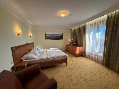 Postel nebo postele na pokoji v ubytování Hotel International