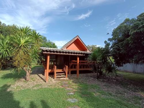 a house with a gazebo in a yard at Doisaket hills in Doi Saket