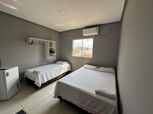 Postel nebo postele na pokoji v ubytování Varandas Hotel