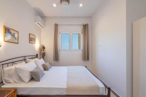 Ένα ή περισσότερα κρεβάτια σε δωμάτιο στο Amelin Villa Paradise